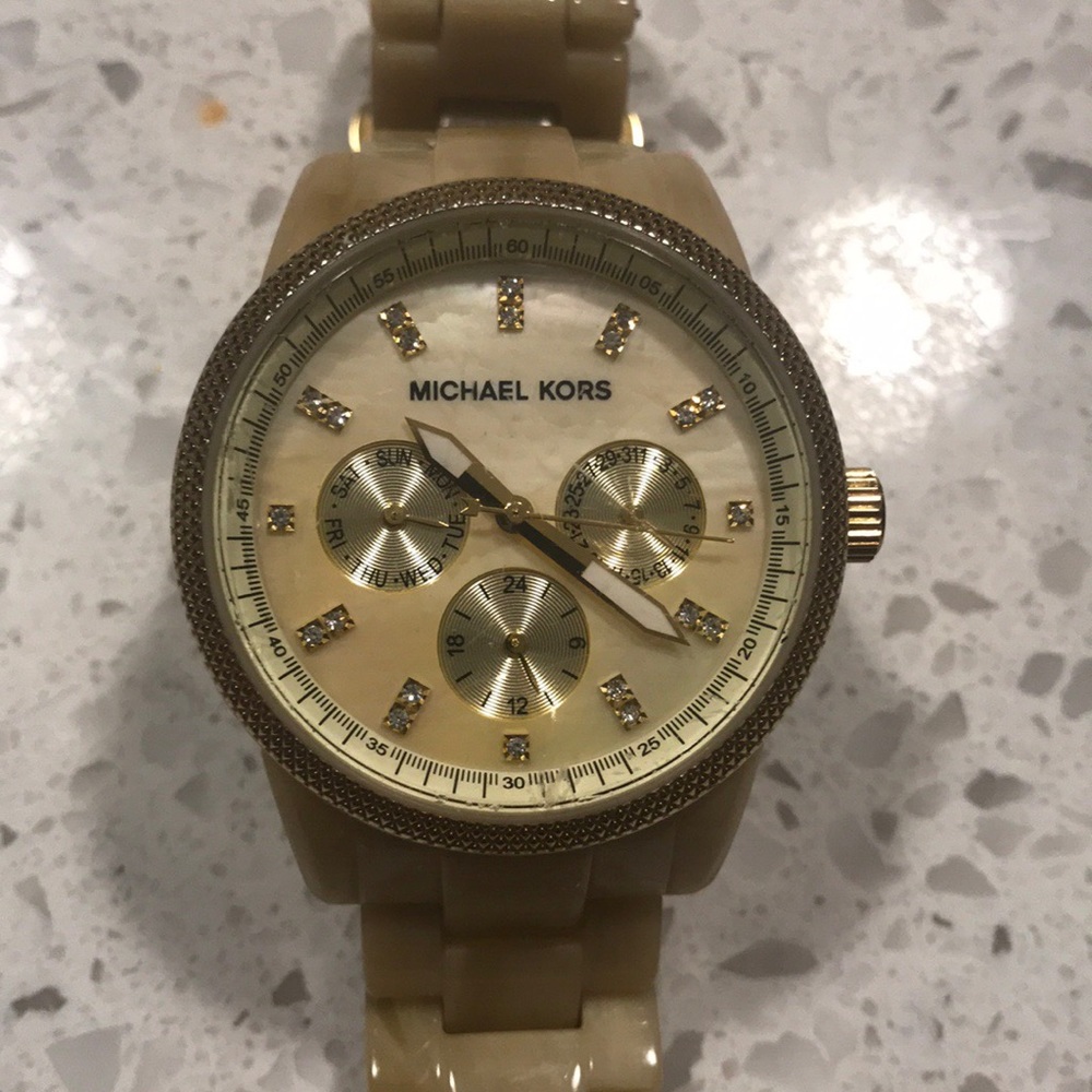 Michael Kors beige ceramic watch.